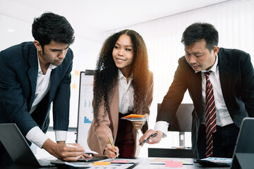 Business corporate team brainstorming, planning strategy having a discussion Analysis investment researching with chart at office desk documents in office.