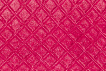 Pink leather and a textured background.