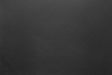 Black color with an old grunge wall concrete texture as a background.
