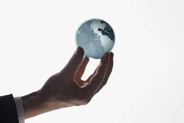businessman holding a globe, earth, planet with a map. Isolated on white background.