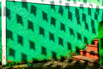 Shade on the houses from the decorative flags for the June festival of São João - obrazy, fototapety, plakaty
