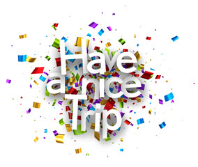 Have a nice trip sign over colorful cut ribbon confetti background.