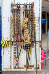 Heavy-duty hooks shackles and rope for 1000 ton mobile crane hanging against container wall