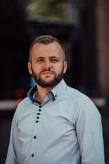 A portrait of a modern man, exuding confidence and style, against an outdoor backdrop, showcasing his charisma and fashionable demeanor.