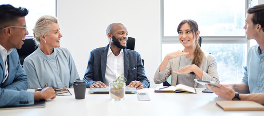 Meeting, planning and collaboration with a business woman talking to her team in the boardroom at work. Teamwork, strategy and brainstorming with a female employee in the office to explain her vision