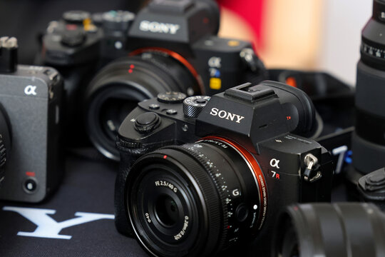 Brand new mirrorless digital camera Sony Alpha 7R closeup displayed at a photo workshop.