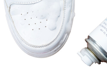 Leather white sneakers with a care kit. Leather footwear care concept