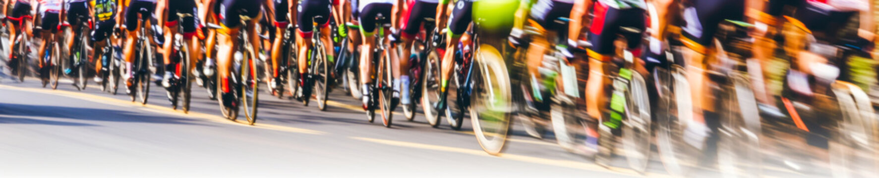 Captivating close-up of a bike peloton racing at full speed, showcasing wheels with striking motion blur trail effect. Experience emotion and thrill in this image! Generative AI