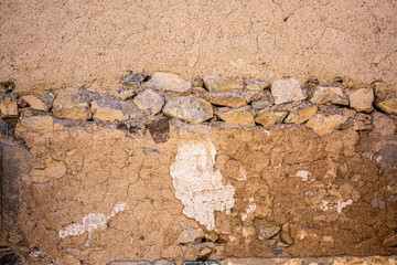 Stone antique old wall as a background or texture. Vintage background of a fortress wall in loft and grunge style with place for text and copy space.