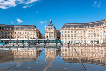 Fototapeta na wymiar Reflection of Place De La Bourse and tramway in Bordeaux, France. Unesco World Heritage Site