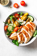 Grilled chicken fillet and greek salad