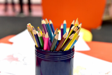 Different colored pencils on a table.