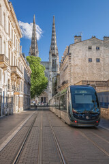 Fototapeta na wymiar Bordeaux Cathedral (Cathedrale Saint Andre) seen from Vital Carles street with bordeaux tram in France