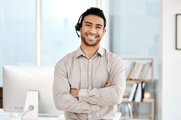 Happy asian man, call center and portrait with headphones in customer service or telemarketing at office. Confident businessman consultant agent smile with arms crossed for online advice at workplace
