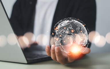 Businessman holding Global network connection. World map point and line composition concept of...