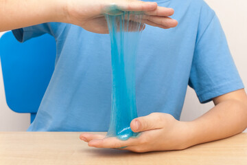 Kid Playing Hand Made Toy Called Slime, Isolated on Withe Background.