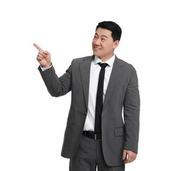 Businessman in suit pointing at something on white background