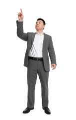Fototapeta premium Businessman in suit posing on white background, low angle view