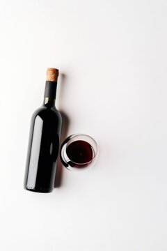 Wine bottle and glass with red wine on white background, created using generative ai technology