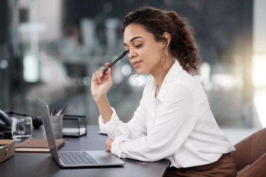 Business woman, laptop and thinking for strategy, planning or corporate decision on office desk. Female person or employee in wonder, choice or doubt on computer for project plan at the workplace