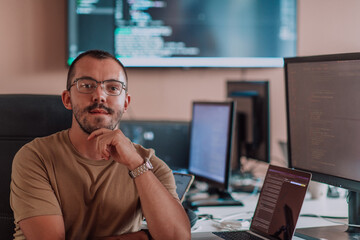 A programmer diligently testing smartphone applications while sitting in their office.