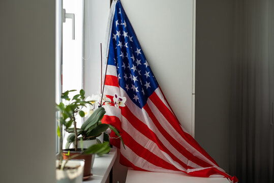 Interior of stylish room with modern workplace and USA flag