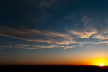 Fototapeta na wymiar Natural landscape of beautiful colourful sunrise with yellow clouds.