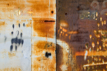 Old cracked paint in craquelure on a rusty metal surfaceGrunge rusted metal texture. Rusty corrosion and oxidized background. Worn metallic iron rusty metal background.	