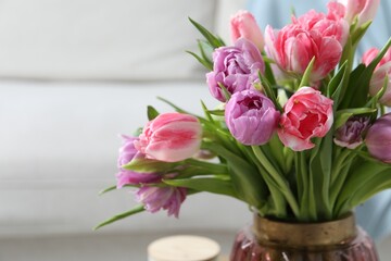 Beautiful bouquet of colorful tulip flowers indoors, closeup. Space for text