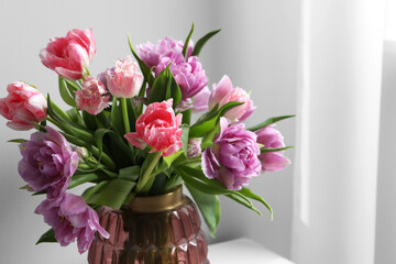 Beautiful bouquet of colorful tulip flowers indoors, closeup. Space for text
