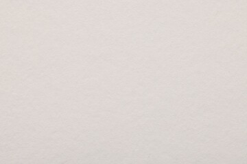 Texture of white paper sheet as background, top view
