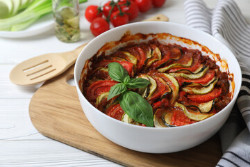 Delicious ratatouille on white wooden table, closeup