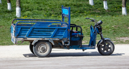 Three-wheeled cargo blue motorcycle