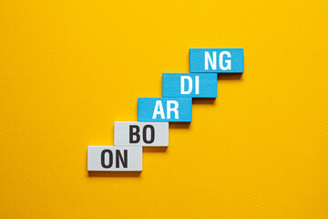 Onboarding - word concept on building blocks, text
