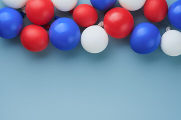 4th of July background. USA paper fans, Red, blue, white stars,  balloons and gold confetti on blue wall background. Happy Labor Day, Independence Day, Presidents Day. American flag colors. Top view.