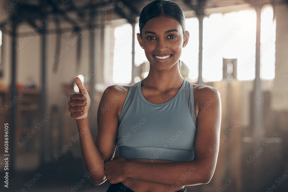 Poster Woman in gym, thumbs up with smile in portrait, like fitness with emoji and health goals with sport and mockup space. Hand gesture, yes and motivation with Indian female athlete at exercise studio