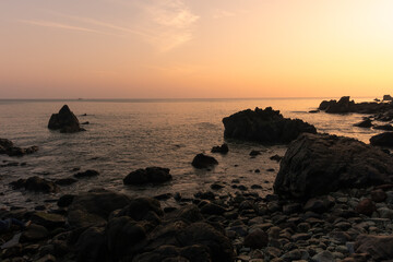 Beautiful view of a rocky shoreline during sunset