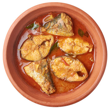 spicy and hot fish curry in a clay pot or bowl isolated background, seafood cooked with coconut milk, served asian cuisine taken straight from above with copy space
