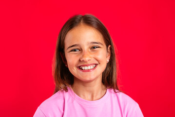 Cheerful teenager smiling and looking at camera