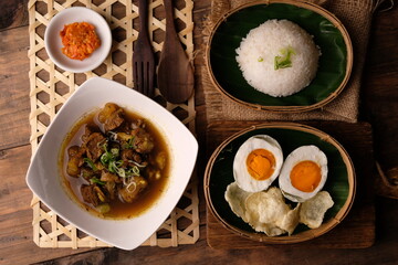 Rawon is an Indonesian beef soup. Originating from East Java, rawon utilizes the black keluak nut as the main seasoning, which gives a dark color and nutty flavor to the soup.