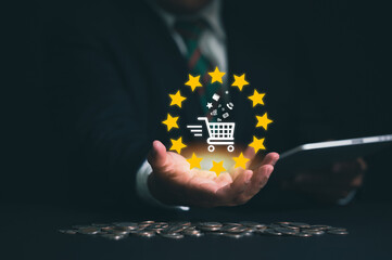 Hand holding virtual info graphics with trolley cart icons , Technology online shopping business...