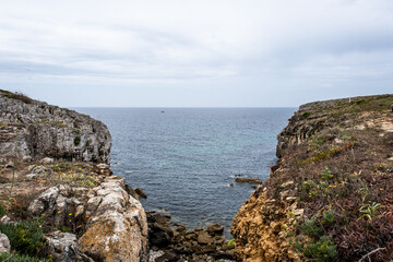 Fototapeta na wymiar Berlenga Islands mountains in Portugal. Cloudy landscape of a cliff in the Iberian Peninsula.