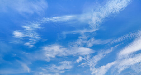 Naklejka na ściany i meble Bright blue sky with fine cirrus clouds, abstract nature background