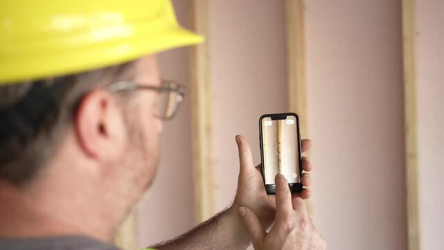 Construction Worker Using Smartphone Augmented Reality App
