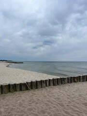 Gray cloudy seascape, cloudy weather at the sea, empty beach