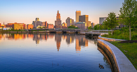 Providence downtown skyline and buildings at sunrise, tranquil water reflections over the River in...