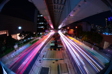 A night timelapse of the traffic jam at the city street in Tokyo fish-eye shot