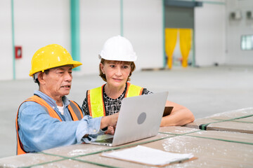 senior woman business manager with warehouse programmer software engineer work with professional service data computer in storage warehouse of storage and transportation logistic