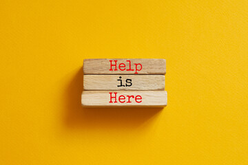 Help is here - word concept on paper, text
