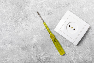 Electrician equipment on marble background with copy space.Top view.Electrician tool set.Multimeter, tester,screwdrivers,cutters,duct tape,lamps,tape measure and wires.Flet lay. © Avocado_studio